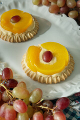 Individual peach tarts Wooden cutting board