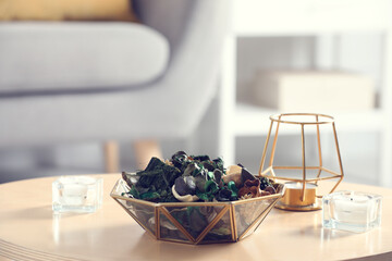 Aromatic potpourri of dried flowers in bowl on wooden table indoors