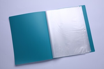 File folder with punched pockets and paper sheets isolated on white, top view