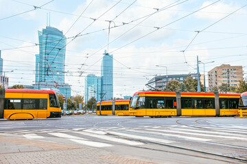 Obraz premium Modern trams on city street. Public transport