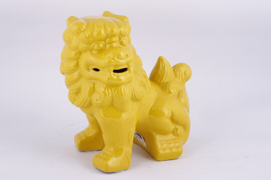 Colorful yellow Chinese clay lion miniature for display