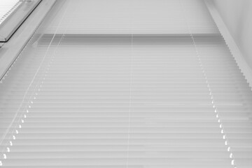 Obraz premium Stylish window with horizontal blinds, low angle view