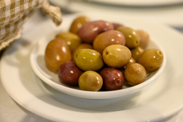 Tasty green olives close up, healthy vegetarian food background