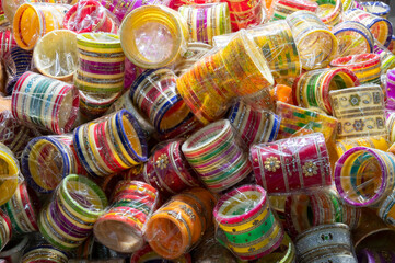 Bright colorful Rajasthani bangles being sold at famous Sardar Market and Ghanta ghar Clock tower in Jodhpur, Rajasthan, India.