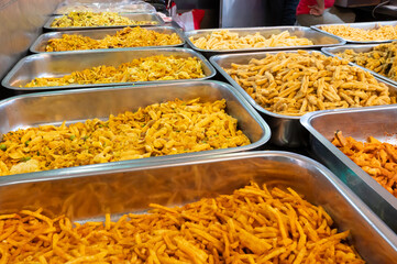 Bhujia, a spicy deep-fried sev filled with a burst of flavors, made using gram flour, moth flour, and different spices, crispy & crunchy traditional namkeen being sold in Jodhpur, Rajasthan, India.
