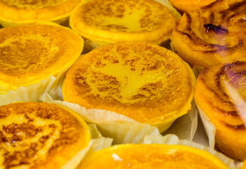 Baked sweet desserts cakes on display in balery in Lisbon, Portugal