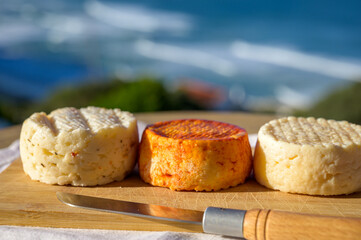 Variety of goat, sheep, cow cheeses made with paprika, herbs in Portugal