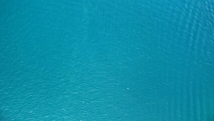 Aerial view of surface of sea. Blue water background