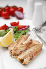 Delicious canned mackerel fillets served on table, closeup