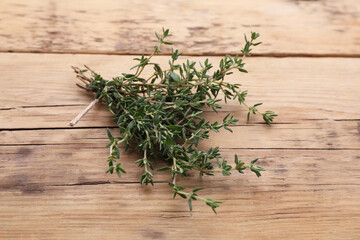 Bunch of fresh thyme on wooden table