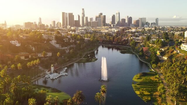 Aerial shot of flying over Echo Park Lake towards downtown Los Angeles in the morning