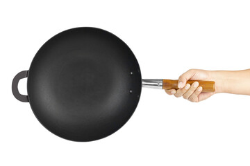 Top view of hand holding cast iron pan with wooden handle isolated on white background with clipping path.