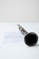 a clarinet on a sheet music