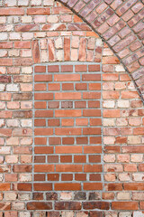 Bricked over doorway in historic brick wall, closed off for modern times
