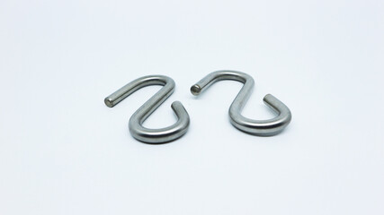 Silver iron s-shaped carabiner hook for hanging goods or outdoor camping isolated white    