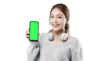 Happy young Asian woman in sweater clothe holds mobile phone with blank empty promo screen. People lifestyle concept. PNG file format transparent background.