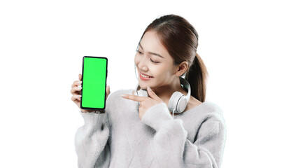Happy young Asian woman in sweater clothe holds mobile phone with blank empty promo screen. People...