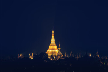 Shwedagon pagoda on hill at night in Yangon Myanmar