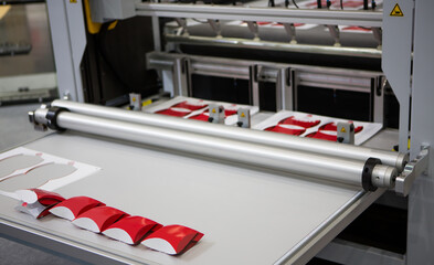 Digital cutting machine. Food folding packaging process on digital cutting machine. Printing...