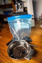 conducting a soil test in a home lab. soil on a table. brown dirt