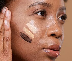 Beauty, makeup and foundation shades on face of black woman with swatch for cosmetics, diversity or...