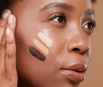Beauty, makeup and foundation shades on face of black woman with swatch for cosmetics, diversity or base tone. Visage, product and glamour with different color on girl model for concealer or textures