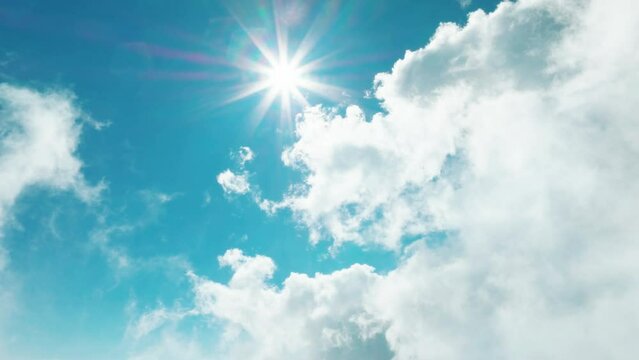 Aerial view of  blue sky with clouds and sun shining
