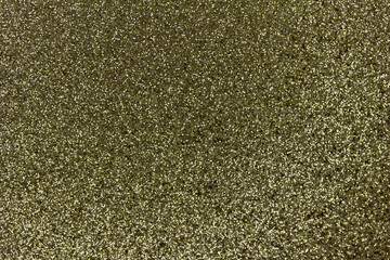 Macro image of a sparkling gold color glitter texture background