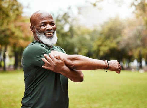 Senior fitness, exercise and black man stretching outdoor at park for energy, health and wellness in retirement. Portrait, face and smile of male in nature for workout, cardio and training in summer