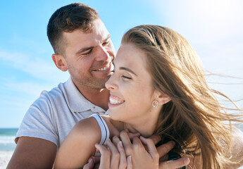 Obraz premium Love, ocean and couple embrace on beach, man and woman hugging at summer morning date. Travel, sea and happy couple relax and hug, spending time together in nature on luxury vacation in Australia