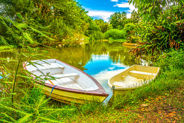 The beautiful landscape ofmall wooden rowing boat on a calm lake.
 Good summer day in nature. Concept vacation on the lake. Banner.
