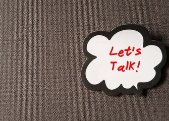 Word balloon speech bubble with text written LET'S TALK, concept of having difficult conversations...