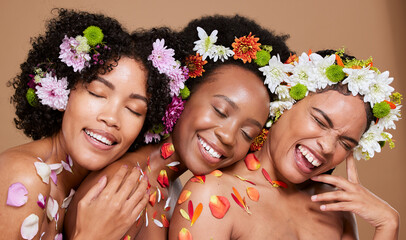 Flowers, skincare and women in studio for beauty, wellness and nature product self care on brown...