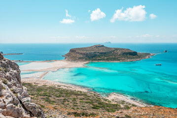 Fototapeta na wymiar Balos lagoon, crete island, greece: view to tagani island with white sandy beach and turquoise blue water at the main tourist destination near chania