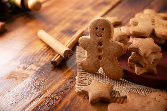 Homemade gingerbread men cookies and star shaped cookies, traditionally made at Christmas and the holidays. Closeup image.