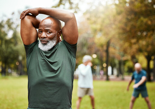 Stretching, exercise and senior man in park enjoying being active in summer, nature and retirement. Fitness, wellbeing and portrait of black man start sports, training and workout for health wellness