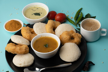 south indian food called idli vada sambar or sambar vada or wada, served with coconut chutney and...