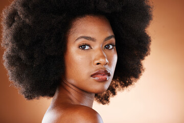 Beauty portrait of black woman with skincare, hair care and natural makeup for facial aesthetics,...