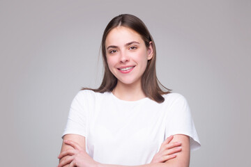 Happy smiling girl. Cheerful young beautiful girl smiling laughing, studio isoalted background. Beauty portrait of beautiful female model.