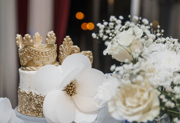 wedding cake. birthday cake and flowers. wedding cake decorated with a large white flower. wedding decorations