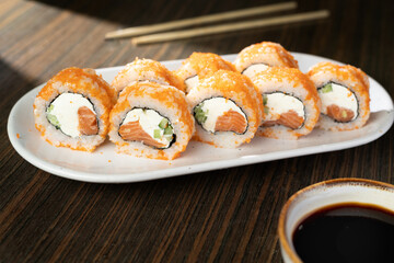 Japanese Cuisine, Sushi Set. sushi rolls on white plate on the table