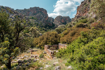 Lissos Gorge Sougia, crete island, greece: hiking through a beautiful cretan canyon with ancient settlement  - obrazy, fototapety, plakaty