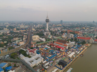 Aerial top view of observation deck viewpoints tower, Samut Prakan urban city town skyline view. Sightseeing exploring city skyline in travel on holiday vacation. Thailand.