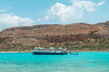 Balos lagoon, crete island, greece: boat cruise to the white sandy beach and turquoise blue water...