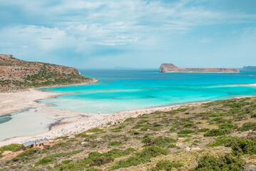 Balos lagoon, crete island, greece: view to gramvoussa island with white sandy beach and turquoise blue water at the main tourist destination near chania