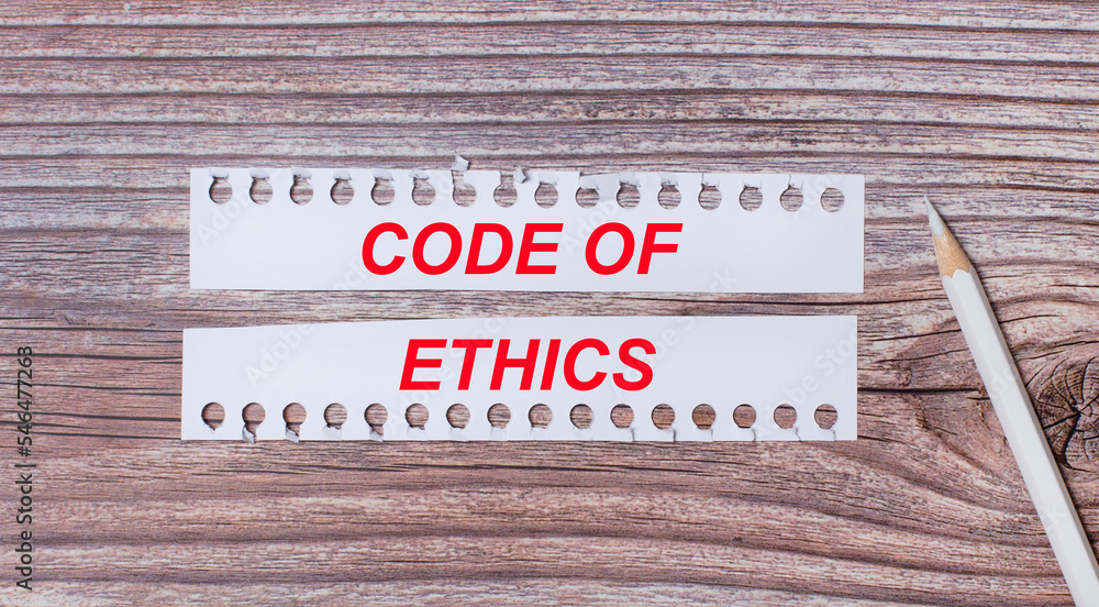 Poster background for text. white strips of paper with the text code of ethics and a white pencil next to i
