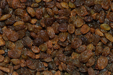 Close-up flat pile fresh shiny brown Australian grown sun-ripened sultanas filling the frame 