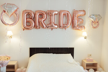 Beautiful room for the bride. The inscription BRIDE from balloons