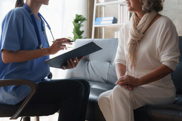 Home healthcare nurse, physical therapy with senior adult woman at home