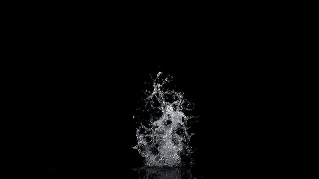 Super Slow Motion Shot of Real Water Splash Explosion from Surface Isolated on Black at 1000fps.